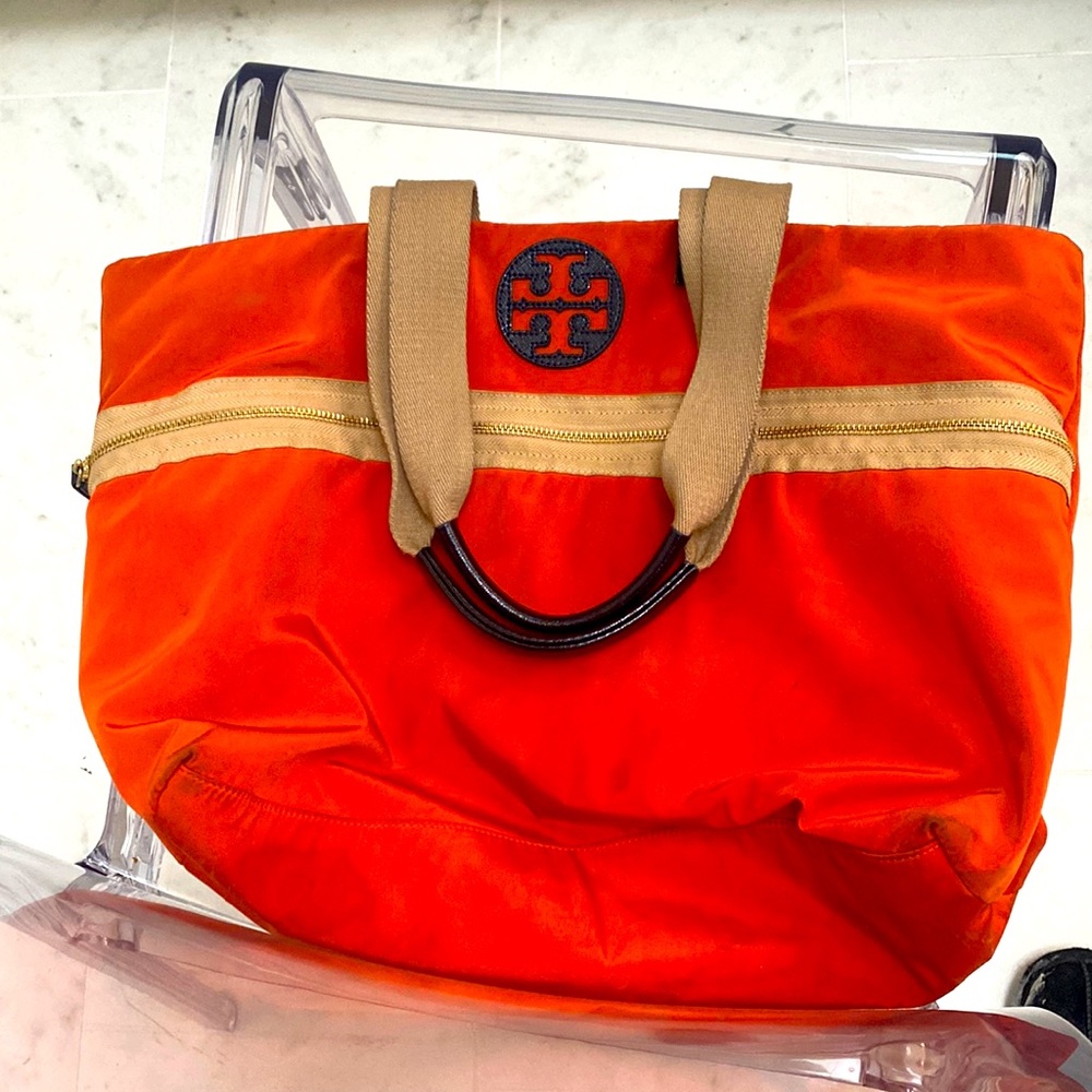 Tory Burch bag fun color could fit books or I pad Lap top this is used wear